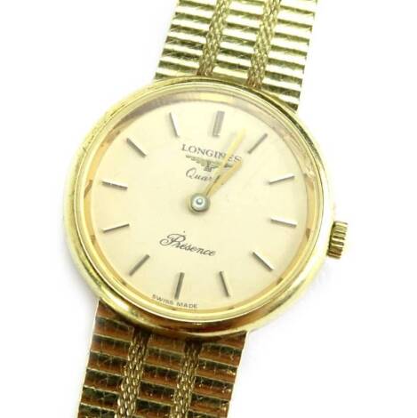 A Longines 9ct gold ladies wristwatch, with small circular dial, part of the presents collection, the dial 2cm W, on a three row articulated bracelet, 27.2g all in.