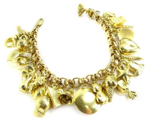 A 9ct gold charm bracelet, with large quantity of charms, (approx 29) comprising teddy bear, fish, dolphins, ice cream cones, sweet, cat, owl, heart, sunshine, car etc., on chunky chain, 32.8g all in, 21cm L.