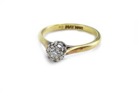 An 18ct gold and platinum diamond solitaire ring, the diamond less than 0.1cts, in illusion platinum setting, on a later plain yellow metal band, ring size L½, 2.4g all in.