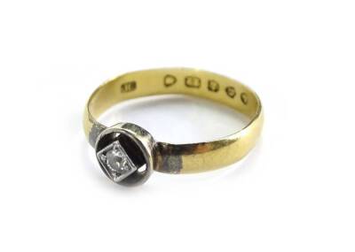 A diamond dress ring, with central diamond shaped border round brilliant cut diamond, in pierced Art Deco style setting, on a later adapted 22ct gold wedding band, 2.5g all in, ring size N. (AF)