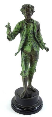 A late 19th/early 20thC French spelter figure, modelled in the form of a gentleman carrying a flower with later green painted finish, on an ebonised plinth, 49cm H.