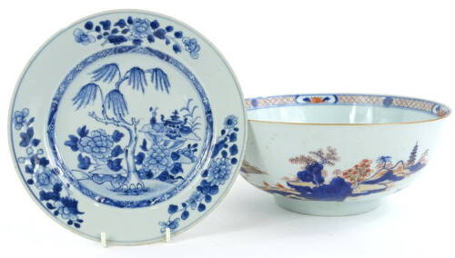 A Chinese Imari bowl, decorated with a mountainous landscape, 27cm diameter, and a Chinese blue and white plate. (2)