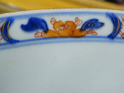 A Chinese Imari bowl, decorated with a mountainous landscape, 27cm diameter, and a Chinese blue and white plate. (2) - 2