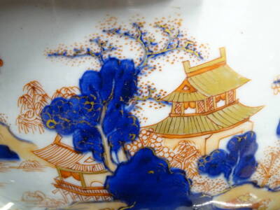 A Chinese Imari bowl, decorated with a mountainous landscape, 27cm diameter, and a Chinese blue and white plate. (2) - 4