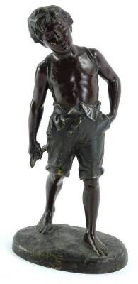 A late 19thC bronze coloured spelter figure of a young boy, modelled wearing short trousers, 32cm H.