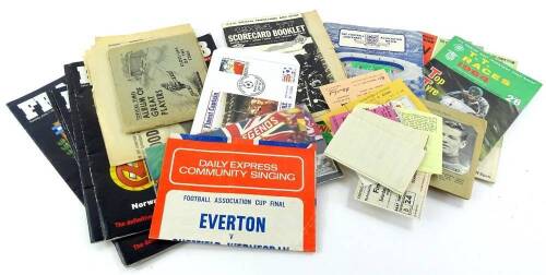 A collection of football programmes etc., to include a 1939 FA Cup Final ticket and others, a community singing sheet for the FA Cup Final 1966, a 1964 Isle of Man TT programme, Topical Times cards, FA Cup Final programmes for 1965 (2), with Leeds United