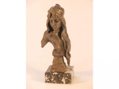 A 20thC bronze resin bust of a long haired damsel