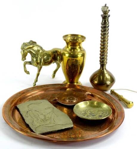 A collection of metalware, to include a heavy brass vase, engraved with flowers, a spirally turned table lamp, Eastern copper tray and a slate cast with two fossilized amphibians.