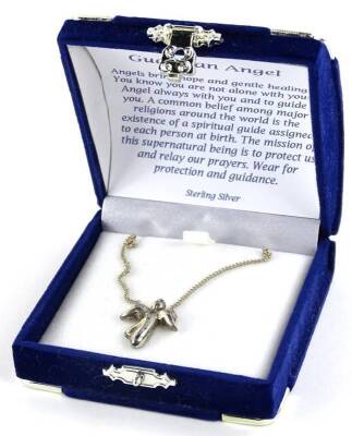 A silver Guardian Angel necklace, the angel set with paste stone, on fine link silver chain, in original box.