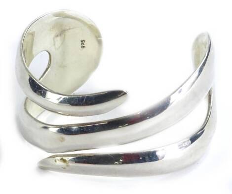 A modern silver bangle, three row wave design, in Moore and Scrupps box.