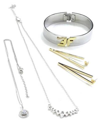 Four items of Fiorelli jewellery, to include a silver necklace, V shaped drop earrings, further silver necklace, and a Fiorelli bangle, with three gift sleeves.