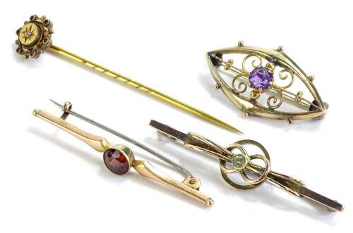 A small quantity of Victorian jewellery, to include three 9ct gold bar brooches, each stone set and a yellow metal stick pin. (4)