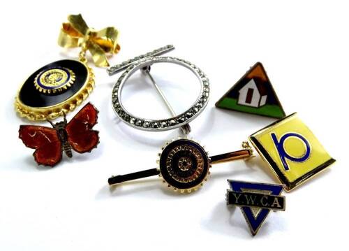 A quantity of modern costume jewellery, to include an enamel YMCA brooch, bow brooch, two in a wheel brooches, an enamel butterfly brooch and a marcasite brooch. (a quantity)