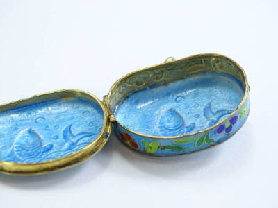 A small enamel and champleve enamel kidney shape pill box, decorated with a fish, flowers etc., 4cm x 3cm. - 2