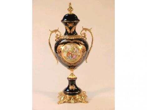 A 20thC continental ovoid urn and fixed cover