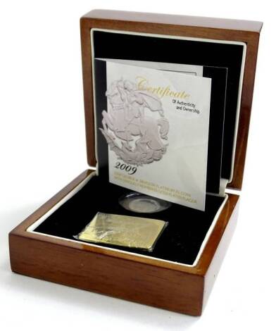 A 2009 George and the Dragon platinum £5 coin, in original box with certificate