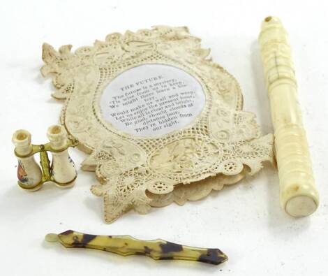 A 19thC bone needle case, containing a Stanhope of Bournemouth, novelty binoculars with Brighton Stanhope and a toothpick and a card titled "The Future" (4)