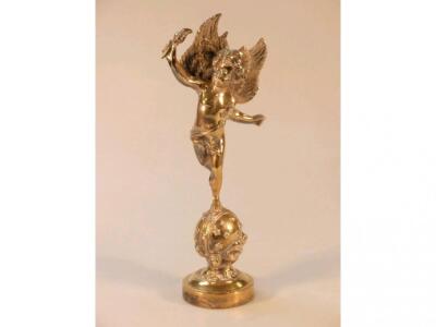 A cast brass figure of a Putto