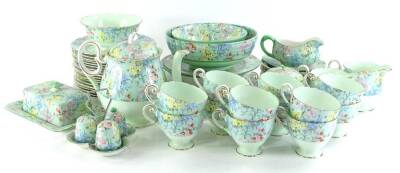 A Shelley Melody pattern part service, to include bowl 20cm diameter, teapot and cover, cruet, preserve jar and cover, cups, saucers, sauce boat on stand, printed marks beneath etc. (a quantity)