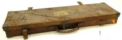 A leather and brass bound shot gun case, containing various fittings etc., 83cm W.