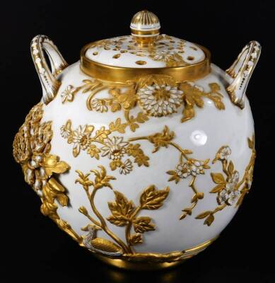 A late 19thC Coalport potpourri vase and cover, of large proportion, the globular body flanked by two handles and raised with various petals and flowerheads, with gilt highlights and a partially pierced lid, on a circular foot, green crown mark beneath, 2 - 3