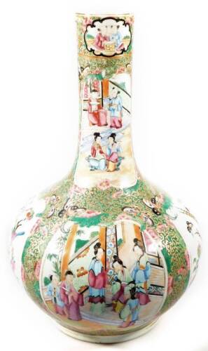 A 19thC Cantonese famille rose vase, with cylindrical stem and bulbous body, heavily decorated with panels of birds, insects and figures, predominately in pink and green with gilt highlights, on a circular foot, unmarked, 36cm H.