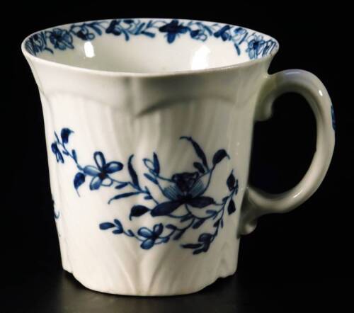 A mid early Worcester coffee or chocolate cup, the body handpainted with a feather moulded floral pattern, bearing workman mark, c1756-58, 6.5cm H. See Branyan, French and Sandon Worcester Porcelain, IE6, page 239.