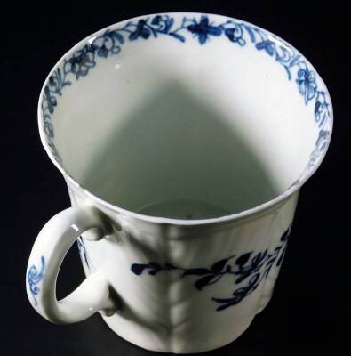 A mid early Worcester coffee or chocolate cup, the body handpainted with a feather moulded floral pattern, bearing workman mark, c1756-58, 6.5cm H. See Branyan, French and Sandon Worcester Porcelain, IE6, page 239. - 3