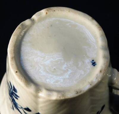 A mid early Worcester coffee or chocolate cup, the body handpainted with a feather moulded floral pattern, bearing workman mark, c1756-58, 6.5cm H. See Branyan, French and Sandon Worcester Porcelain, IE6, page 239. - 4