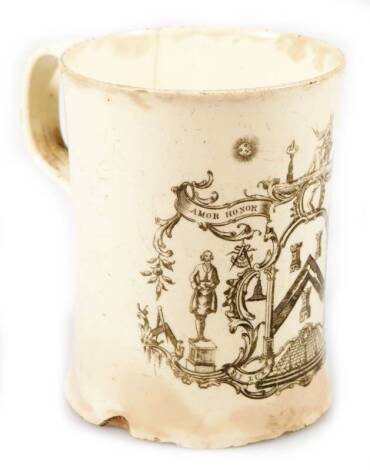 A late 18thC English creamware tankard, probably Leeds, printed with a Masonic armorial, with loop and scroll handle, 9cm H.