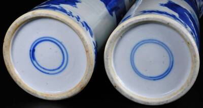 A pair of 19thC Chinese blue and white porcelain vases, each of cylindrical form, decorated with figures of ladies in an exterior setting with prunus and further figures and a lower floral border, double circle marks beneath, 31cm H. (2) - 4