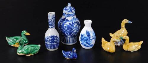 A collection of Chinese miniature porcelain, comprising of a blue and white vase and cover, 11cm H, six duck figures, a Japanese blue and white vase and a further vase decorated with figure on bridge, with three character mark beneath. (a quantity)