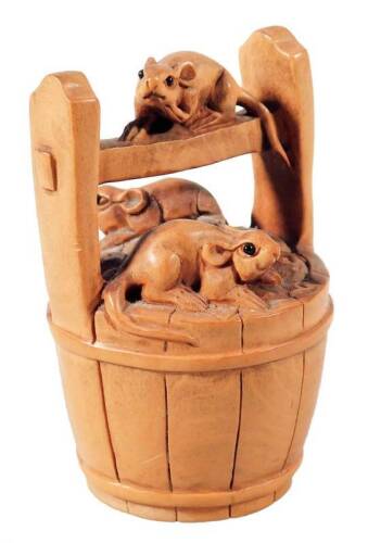 A Japanese Taisho period netsuke, carved with three rats in a bucket, soft wood, marked beneath, 6cm H.