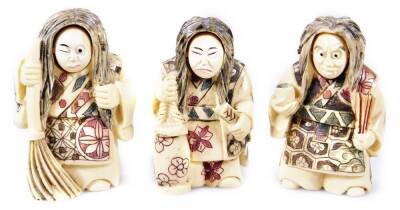 Three 20thC netsuke figures, formed in flowing robes picked out in colours, with floral jackets, resin, 5cm H. (3)