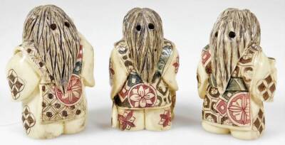 Three 20thC netsuke figures, formed in flowing robes picked out in colours, with floral jackets, resin, 5cm H. (3) - 2