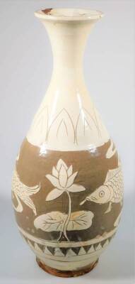 A Korean Koryo pottery vase, with compressed trumpet stem and bulbous body, sgraffito decorated with fish and flowers, in cream and brown glazes, on a circular foot, 34cm H. - 4