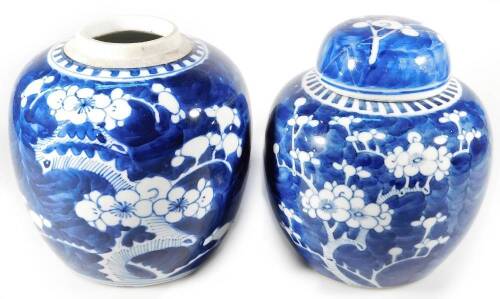 A Chinese Qing period blue and white porcelain prunus vase, the ovoid body typically decorated, 15cm H, and another similar with cover. (2)