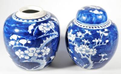 A Chinese Qing period blue and white porcelain prunus vase, the ovoid body typically decorated, 15cm H, and another similar with cover. (2) - 3