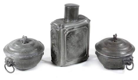 An early 20thC Chinese pewter Shantou tea caddy, of shouldered form with removable lid, the body set with chased panels of birds, 22cm high and two lidded caskets of circular form, seal marks beneath. (3)