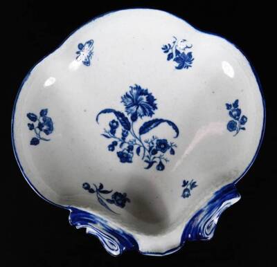 An 18thC Worcester shell shaped dish, in blue and white floral decoration within a moulded basket weave border, c1785, 19cm W. - 2