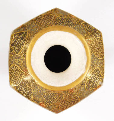 A 19thC Japanese satsuma pottery vase by Hattori Zo of octagonal form with an inverted cylindrical stem, profusely decorated with figures, with gilt highlights, on a circular foot, 17cm H, and a similar two handled koro, each marked beneath. (2) - 6