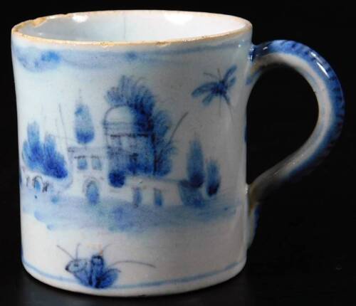 An 18thC Chinese blue and white export porcelain coffee can, the cylindrical body with decorative handle on a circular foot, Kangxi floral mark beneath, 6cm H. (AF)