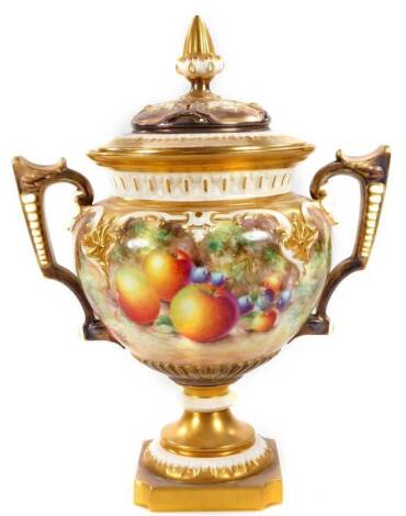 A 20thC Royal Worcester fruit painted potpourri vase and cover, by Malcolm Johnson, handpainted with autumnal fruits to include apples, grapes and gooseberries, with gilt highlights, compressed partially pierced lid, angular thumb mould handles, inverted 