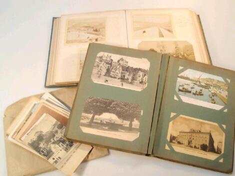 An early 20thC postcard album with approximately 90 topographical cards