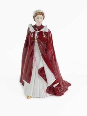 A Royal Worcester porcelain figure modelled as Her Majesty The Queen