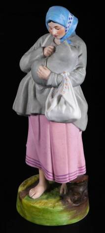 A Russian Gardner bisque porcelain figure group, of a lady holding child and bag in naturalistic setting, polychrome decorated predominately in pink, grey, blue and green, printed and impressed marks beneath, 25cm H.