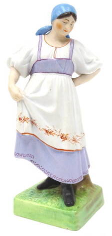 A Russian Gardner porcelain figure, of a lady wearing a turquoise head scarf and purple dress with cream and red pinafore, on a square base, printed mark in red to underside, 20cm H.