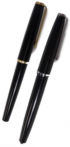 A 20thC Pelikan fountain pen, in black with gilt clip and trim, 13cm W, and a Platignum Silverline Italic fountain pen. (2,AF)