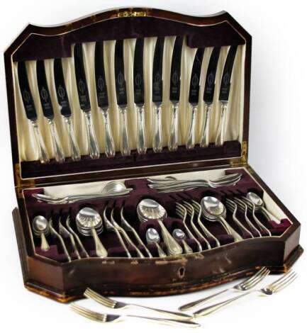 An Elizabeth II silver canteen of cutlery, by Edward Viner, settings for six, to include forks, knives, spoons, etc. the knives with plated blades, Sheffield 1956 & 1958 etc, in a walnut serpentine canteen, 10cm H, 46cm W, 30cm D.