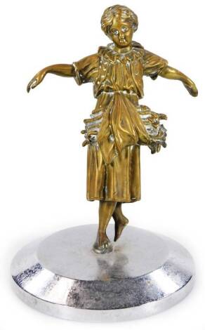 A mid 20thC Art Deco metal figure group, of a girl in flowing robes carrying flowers, on a chrome plated base, 20cm H.